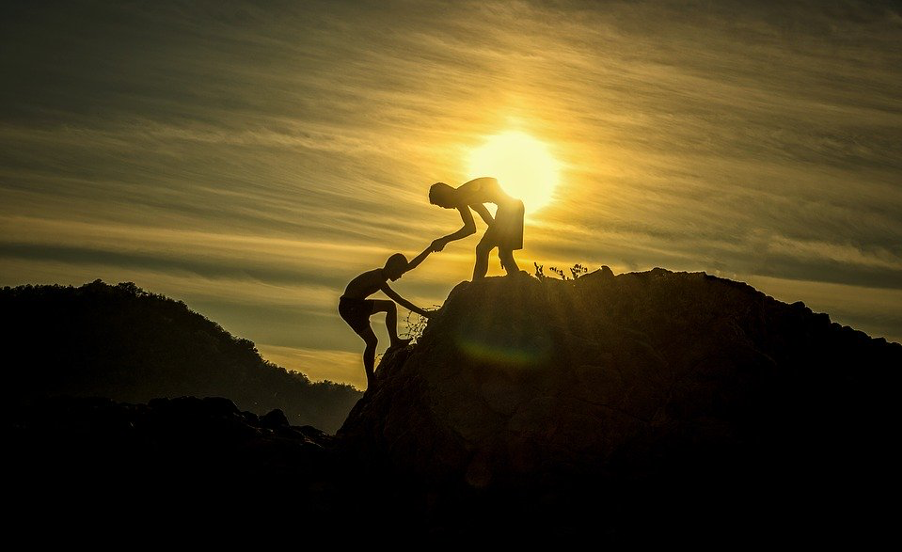 Boys Climbing In Sunset